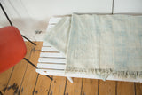 Ivory and powder blue vintage African textile with short tassels and hand woven texture.