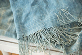 Intricate hand woven texture and long fringed tassels of the powder blue African textile.