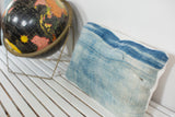 Vintage light blue indigo pillow, sun-faded handmade textile with horizontal stitching. 12 x 20 inches.