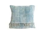 Vintage indigo pillow with distinctive sun-faded textile and short tassels.