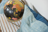 Textured light blue vintage African indigo pillow with darker blue canvas.