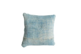 Vintage light blue indigo pillow, displaying its distinctive sun-faded textile texture.