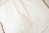 Textured off-white European linen back on the Heriz pillow.