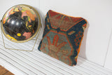 Corner of antique Caucasian rug fragment pillow, geometric blue pattern, natural wear, tangerine velvet.