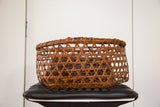 Delicate hand-woven lattice design on a vintage Japanese basket with aged patina.
