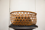Delicate hand-woven geometric pattern and coiled rim of the vintage Japanese basket.