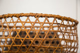 Delicate hand-woven geometric cane pattern on the rim of the vintage Japanese basket.