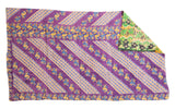 Vibrant vintage Kantha quilt featuring purple patterned side and green floral reverse.