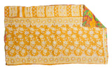 Vintage Indian Kantha quilt corner with yellow floral pattern and bright multi-color reverse.