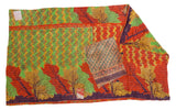 Vibrant vintage Indian Kantha quilt showcasing hand-stitched tree motifs and folded patterned reverse.