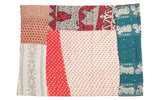 Vintage Indian Kantha quilt featuring an unusual motorcycle pattern on teal and colorful patchwork.