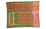 Kantha Quilt's visible hand-stitch texture on terracotta, green, and beige floral patterns.