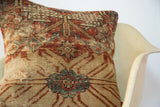 Aged Mahal rug pillow with faded terracotta, beige, and aqua geometric pattern.