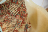 Antique Mahal Persian rug pillow fragment, showing time-softened terracotta and aqua blue weave.