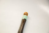Hand-painted face and mint green top of a vintage repurposed wooden peg doll.