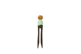 Repurposed vintage peg doll, hand-painted with light green shirt and dark wood legs.