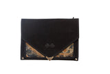 Handmade rug fragment clutch with a black suede envelope flap and gold metal hardware.