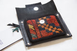 Rug Fragment Coin Purse featuring colorful red, blue, gold pattern and silver magnetic snap.