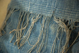 Vintage African Indigo pillow fabric with sun-faded blue texture and frayed stitching.