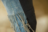 African Indigo handmade pillow edge detail, with tied threads and black linen back.