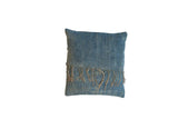 African Indigo handmade throw pillow, sun-faded blue textile with vertical texture and fringe.