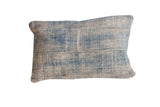Vintage African Indigo handmade pillow with sun-faded blue textile and visible stitched panels.