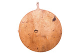 Large vintage wooden pizza serving board featuring rich patina and natural wood grain, 26