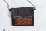 Antique Kurdish Rug Fragment Bag with dark leather and geometric terracotta, blue, brown pattern.
