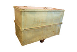Light mint green vintage industrial factory cart with aged patina and wood top.