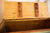 Opened reclaimed wood top revealing the factory cart's aged interior storage space.