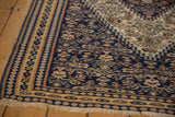 Secured edge and intricate geometric borders of a handwoven antique Persian Senneh Kilim.