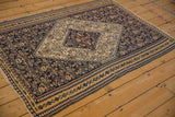 Angled view of an antique Senneh Kilim, highlighting the implied movement in its intricate design.