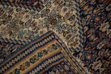 Folded corner of an antique Persian Senneh kilim reveals its fine hand-woven construction.