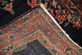 Hand-knotted foundation weave visible on the folded corner of a vintage Sarouk rug runner.