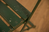 Vintage French Cafe Chair: worn green wooden slats and metal frame with patina.
