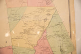 Close-up of the aged paper and pastel-colored districts on the antique Pound Ridge map.