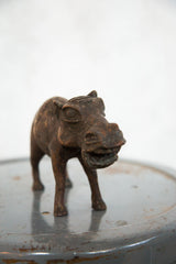 Detailed aged copper hippo sculpture, front view showing its expressive open mouth.