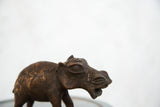 Vintage African copper hippo sculpture: close-up of expressive face and open mouth.