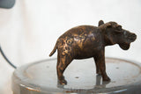 Textured copper patina on the rear of the vintage African hippo sculpture.
