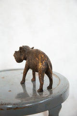 Rear view of vintage African hippo sculpture with rich, textured copper patina.
