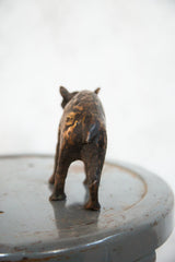 Vintage African copper hippo sculpture, rear view showcasing its dark, mottled patina.