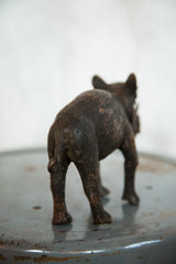 Patinated copper texture on the back and tail of the vintage rhino sculpture.