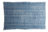 Vintage hand woven African indigo textile throw with blue and pale striped patterns.
