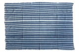 Hand-dyed African indigo textile throw featuring variegated blue stripes, 3'8