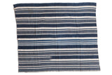 Collectible hand woven African indigo striped textile throw in deep blue and off-white.