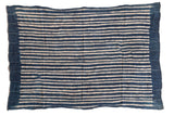 Collectible hand-woven Batik indigo African textile with blue and off-white stripes.