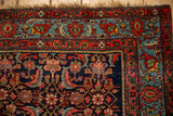 Corner of a collector's antique Bijar rug, showing multiple borders and the indigo Herati field.
