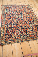 High-angle view of a finely woven Persian Tabriz rug with a classic Herati design.