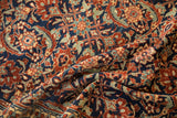 Finely drawn Herati motif in navy blue, dusty gold, and aqua on a soft hand-knotted wool pile.