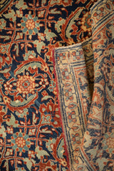 Vintage Tabriz rug folded to show the fine Sennehbaft weave of its foundation.
